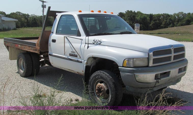 image for item E2102 1998 Dodge Ram 3500 Laramie SLT flatbed pickup truck