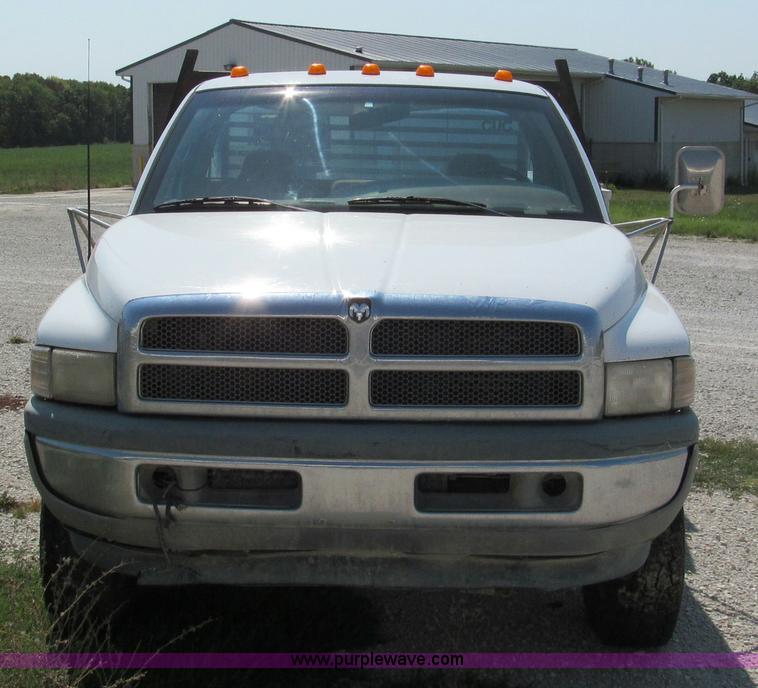 image for item E2102 1998 Dodge Ram 3500 Laramie SLT flatbed pickup truck