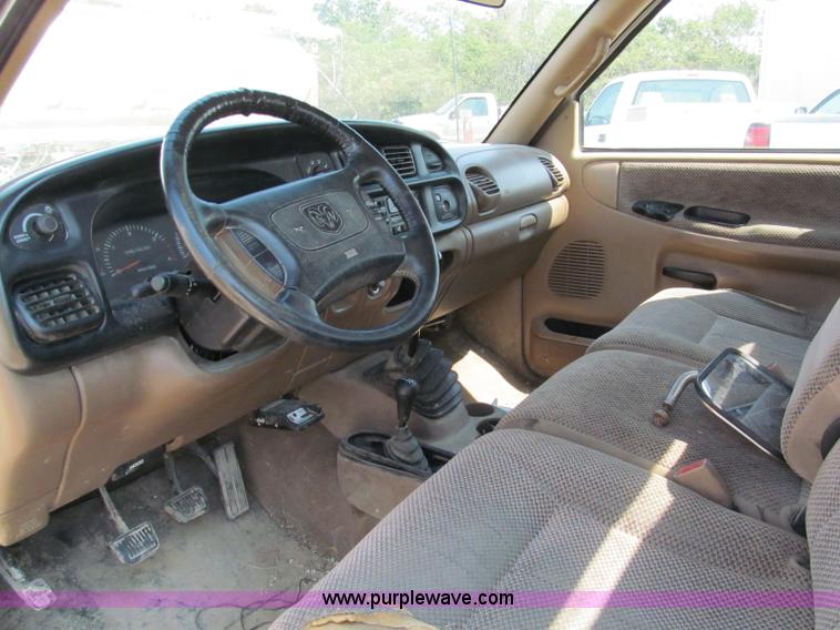 image for item E2102 1998 Dodge Ram 3500 Laramie SLT flatbed pickup truck