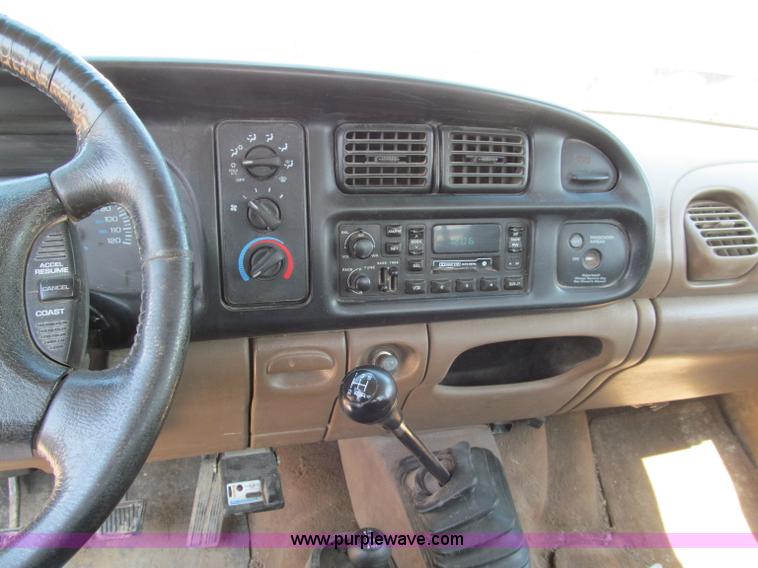 image for item E2102 1998 Dodge Ram 3500 Laramie SLT flatbed pickup truck