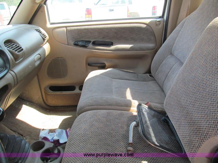 image for item E2102 1998 Dodge Ram 3500 Laramie SLT flatbed pickup truck