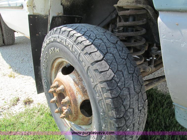 image for item E2102 1998 Dodge Ram 3500 Laramie SLT flatbed pickup truck