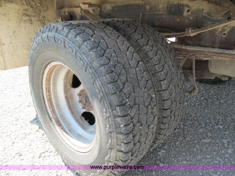 image for item E2102 1998 Dodge Ram 3500 Laramie SLT flatbed pickup truck