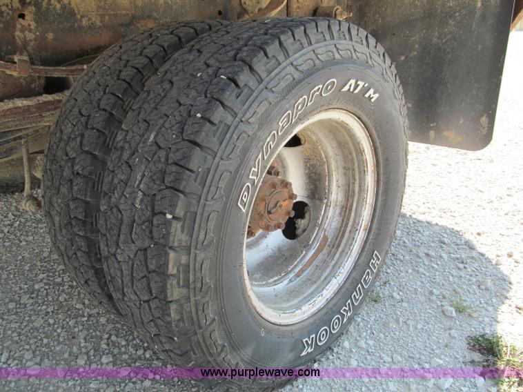 image for item E2102 1998 Dodge Ram 3500 Laramie SLT flatbed pickup truck