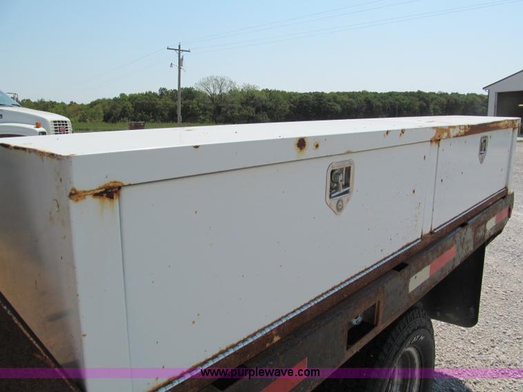 image for item E2102 1998 Dodge Ram 3500 Laramie SLT flatbed pickup truck