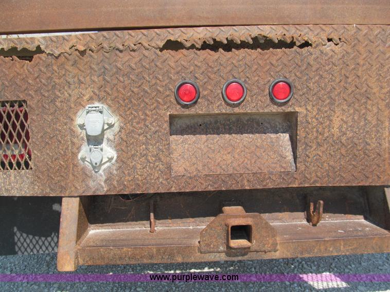 image for item E2102 1998 Dodge Ram 3500 Laramie SLT flatbed pickup truck