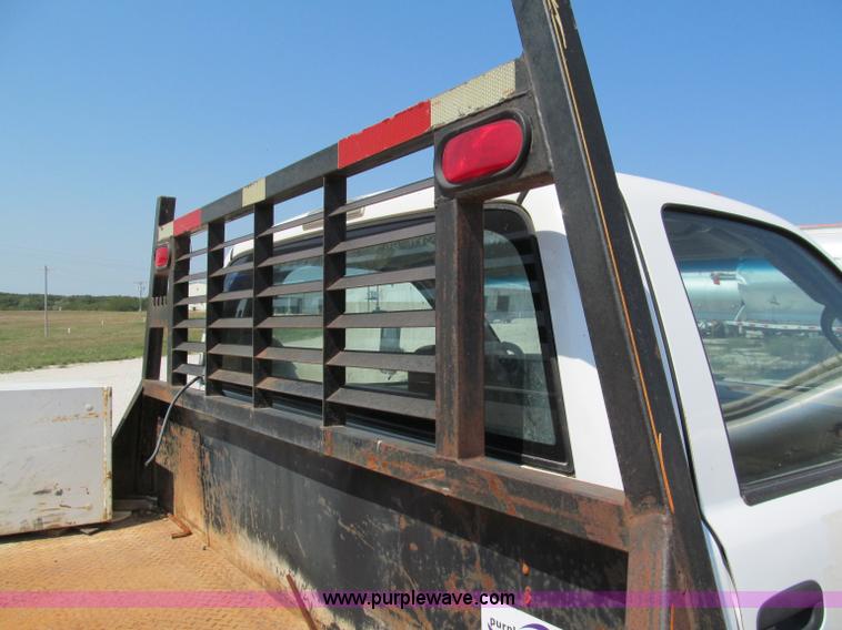 image for item E2102 1998 Dodge Ram 3500 Laramie SLT flatbed pickup truck