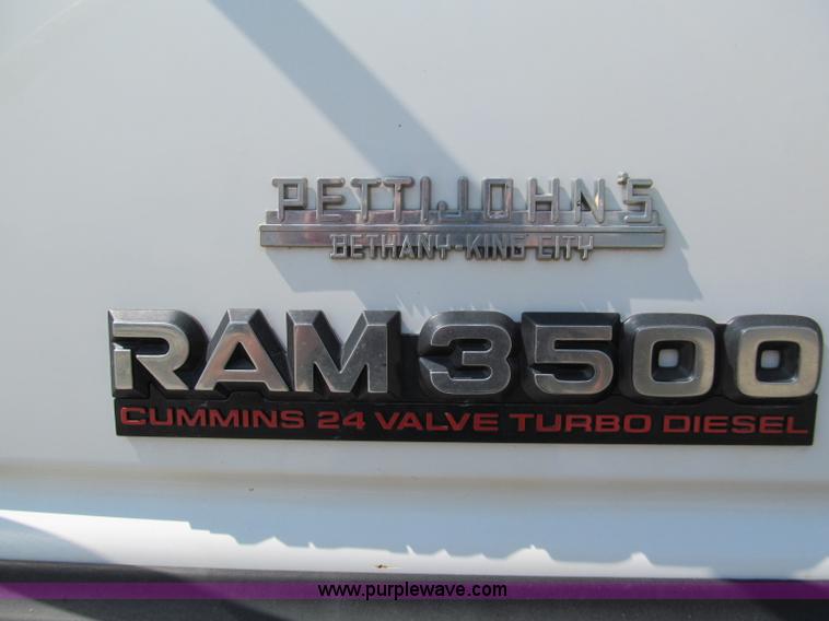 image for item E2102 1998 Dodge Ram 3500 Laramie SLT flatbed pickup truck