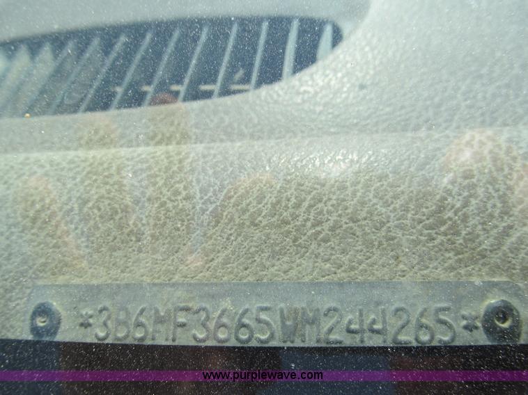 image for item E2102 1998 Dodge Ram 3500 Laramie SLT flatbed pickup truck