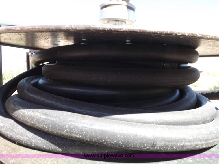 image for item F6020 Two fuel pumps and a hose reel