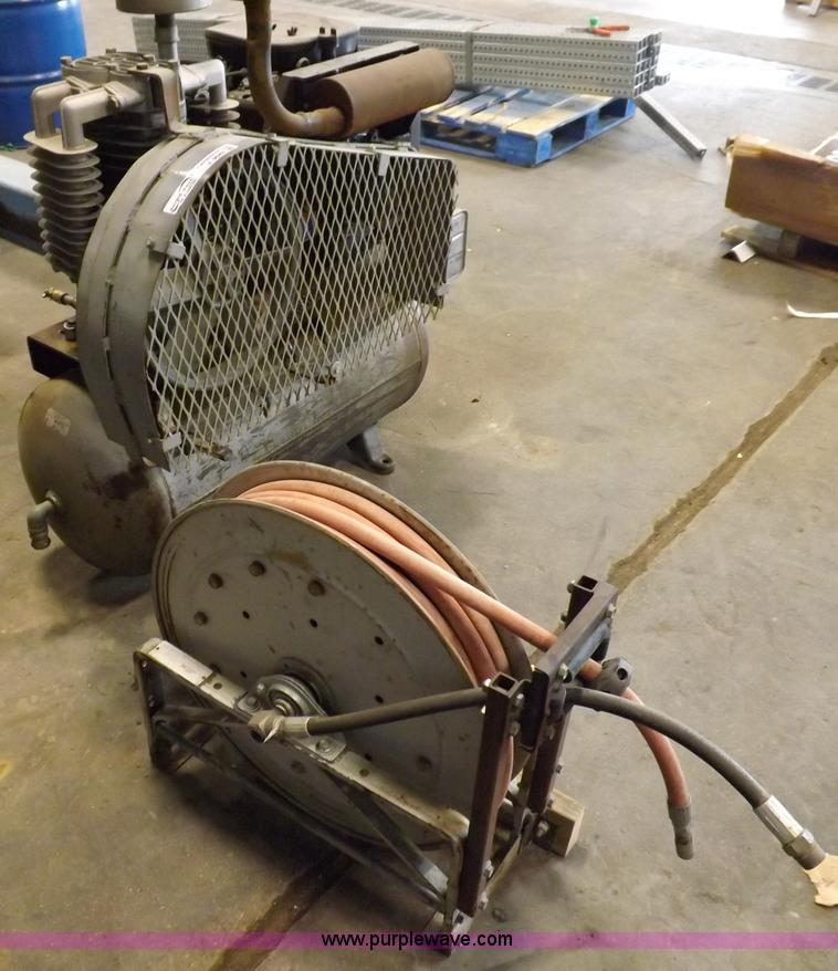 image for item J9042 Air compressor and hose reel