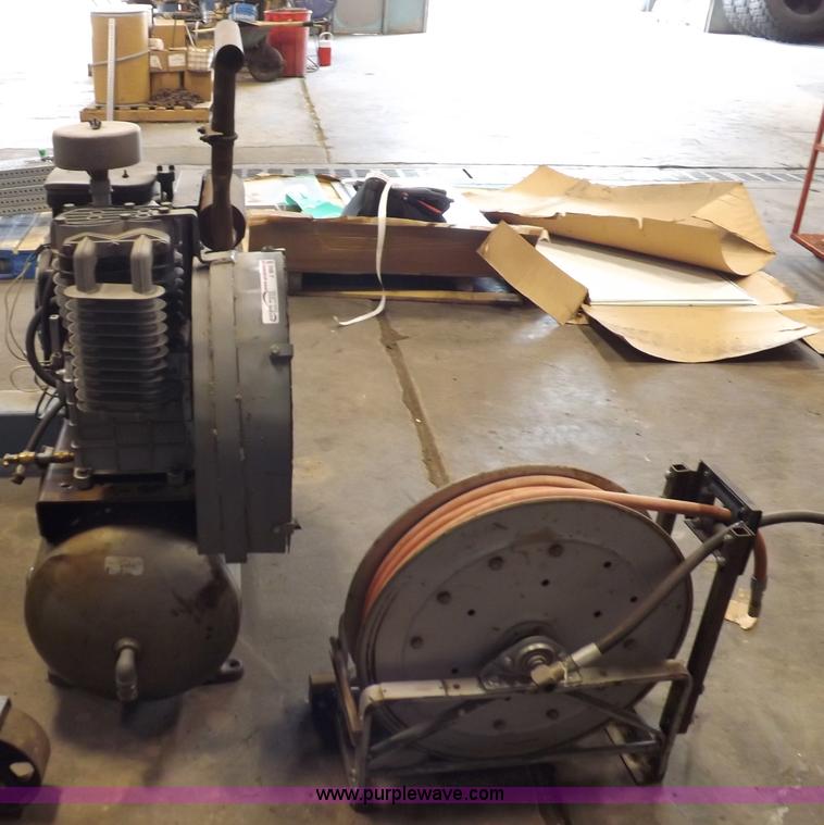 image for item J9042 Air compressor and hose reel