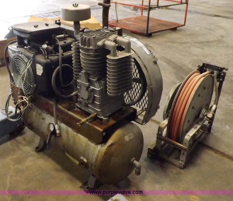 image for item J9042 Air compressor and hose reel