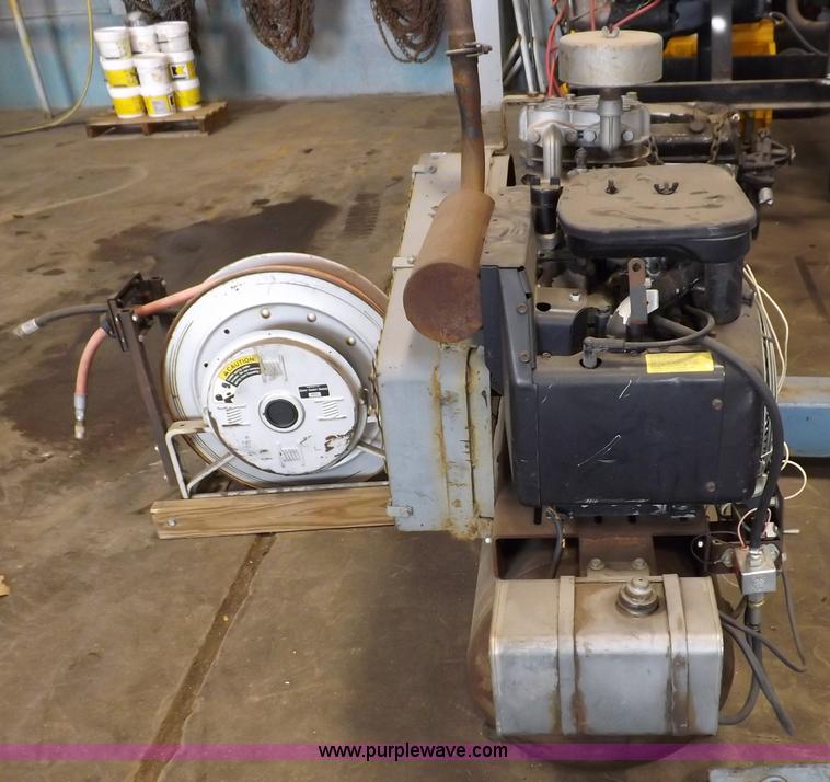 image for item J9042 Air compressor and hose reel