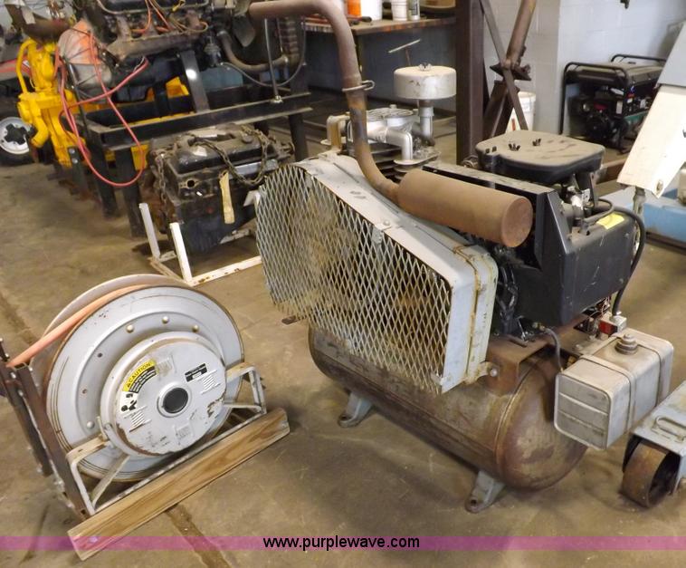 image for item J9042 Air compressor and hose reel