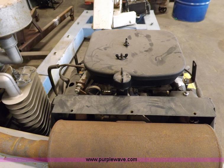 image for item J9042 Air compressor and hose reel