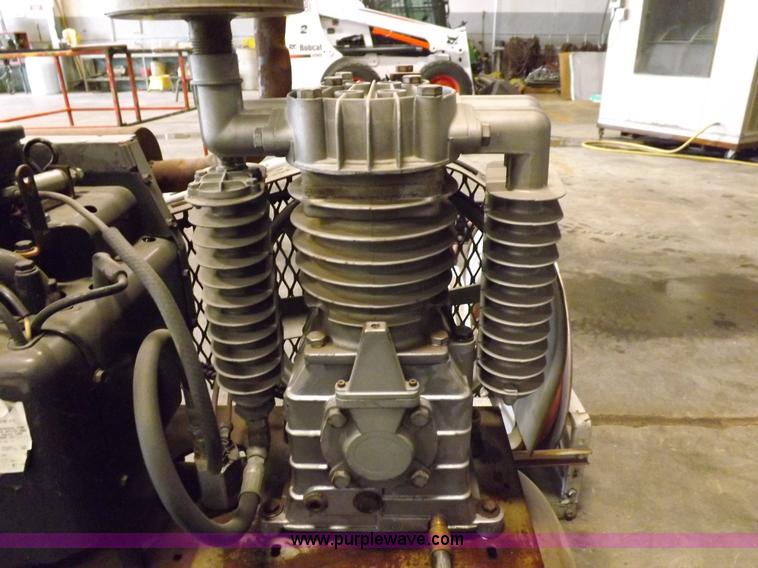 image for item J9042 Air compressor and hose reel