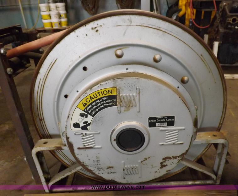 image for item J9042 Air compressor and hose reel