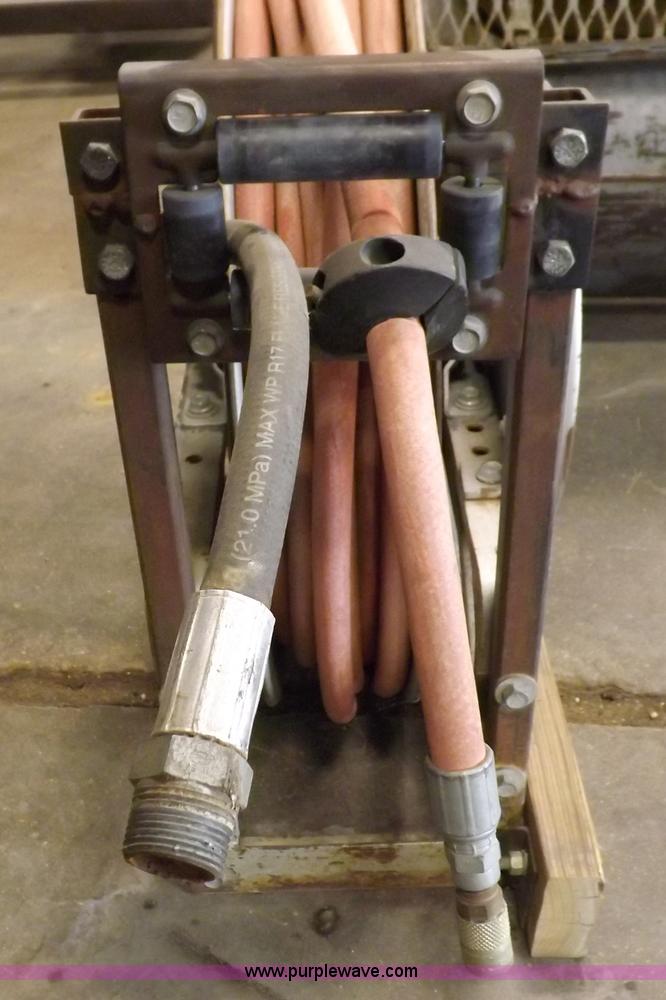 image for item J9042 Air compressor and hose reel