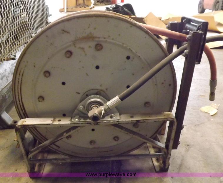 image for item J9042 Air compressor and hose reel