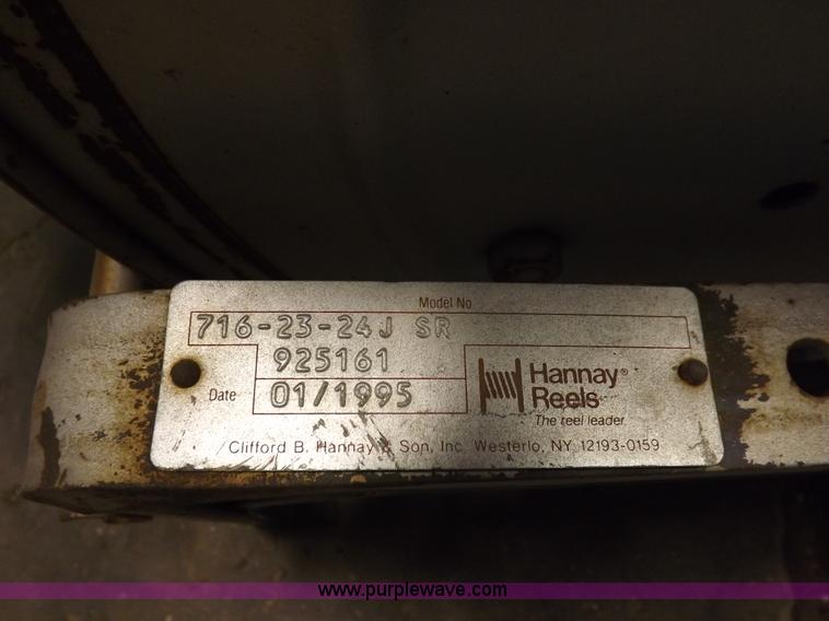 image for item J9042 Air compressor and hose reel