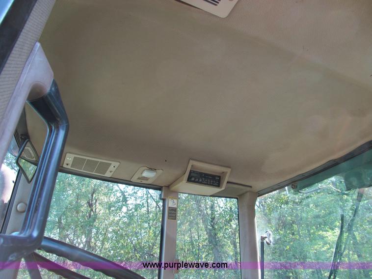 image for item E3505 1991 John Deere 7700 MFWD tractor