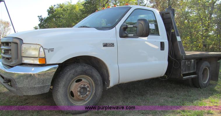 image for item E3509 1999 Ford F350 Super Duty flatbed pickup truck