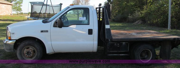 image for item E3509 1999 Ford F350 Super Duty flatbed pickup truck