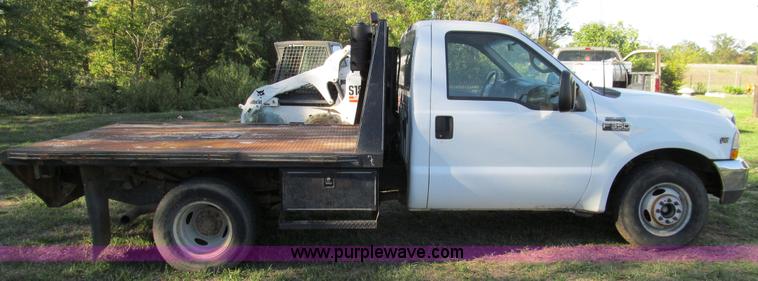image for item E3509 1999 Ford F350 Super Duty flatbed pickup truck