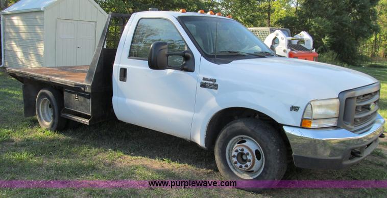 image for item E3509 1999 Ford F350 Super Duty flatbed pickup truck