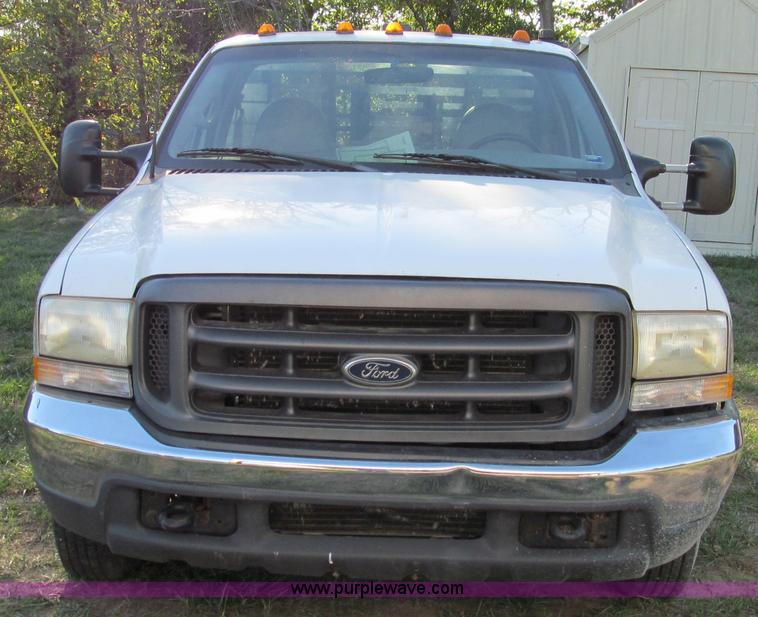 image for item E3509 1999 Ford F350 Super Duty flatbed pickup truck
