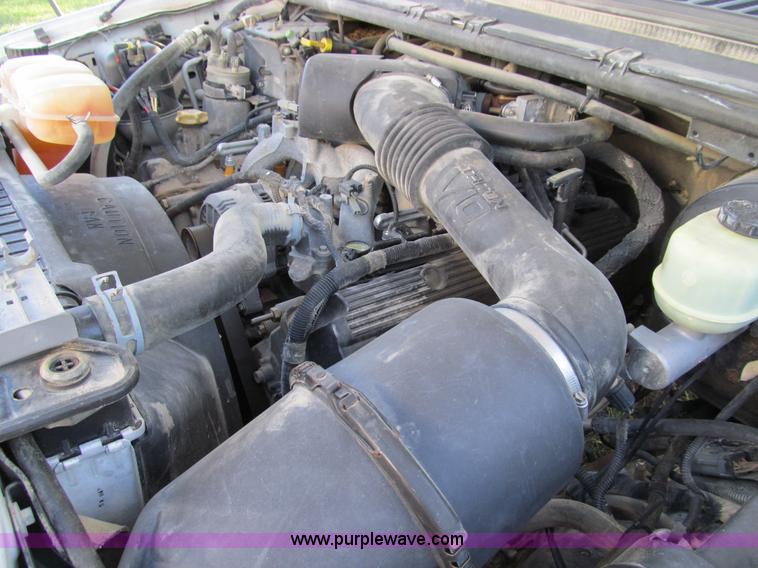 image for item E3509 1999 Ford F350 Super Duty flatbed pickup truck