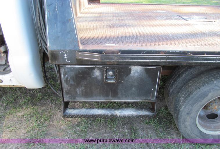 image for item E3509 1999 Ford F350 Super Duty flatbed pickup truck