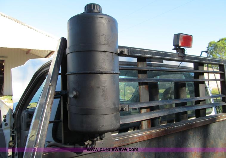 image for item E3509 1999 Ford F350 Super Duty flatbed pickup truck