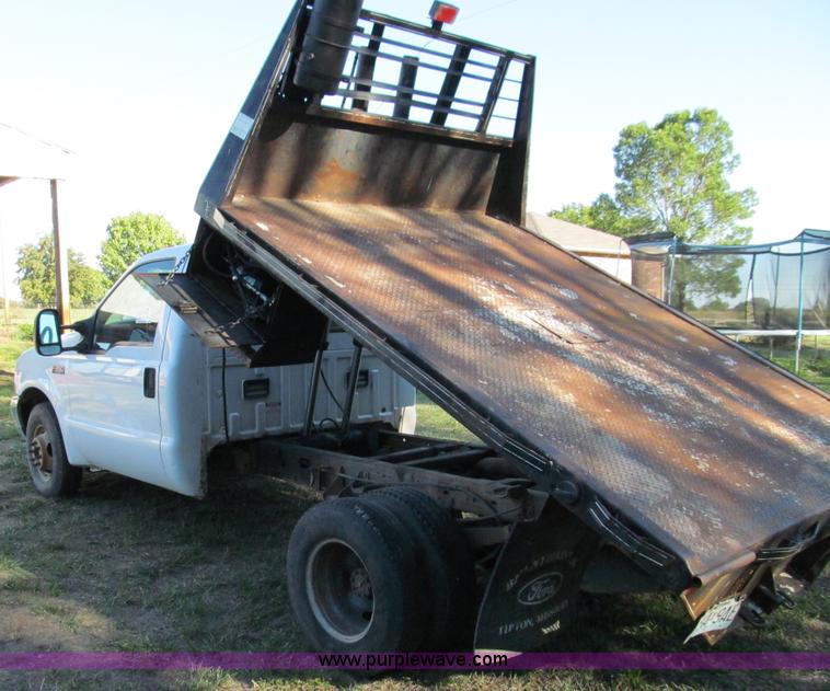 image for item E3509 1999 Ford F350 Super Duty flatbed pickup truck