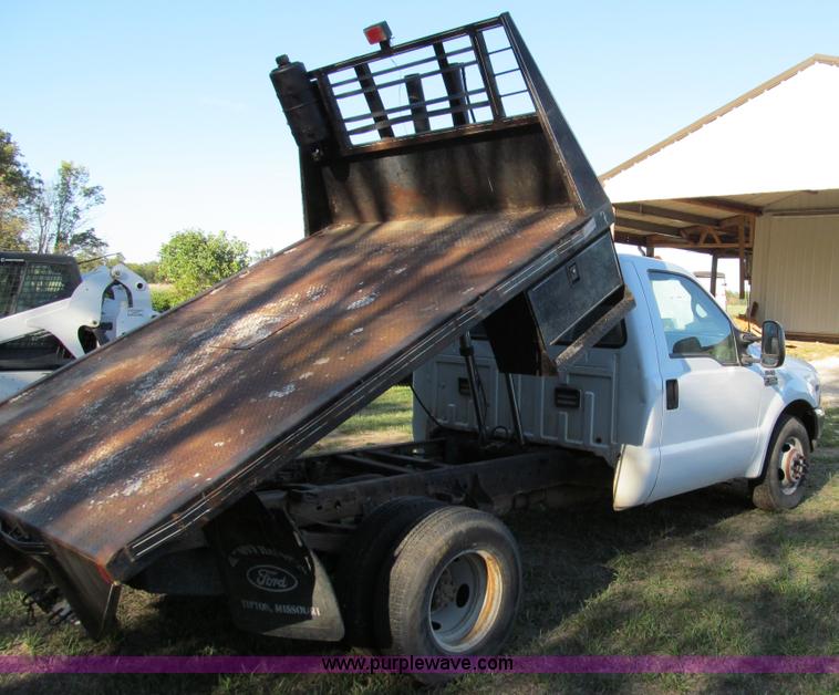 image for item E3509 1999 Ford F350 Super Duty flatbed pickup truck