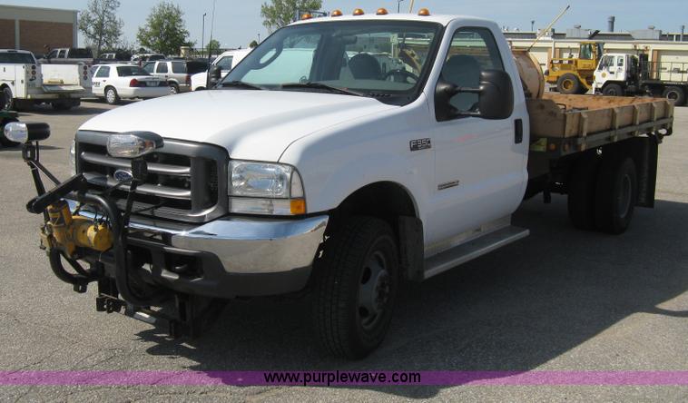 image for item B8133 2003 Ford F350 XL Super Duty flatbed pickup truck