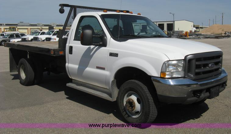 image for item B8134 2004 Ford F350 XL Super Duty flatbed pickup truck