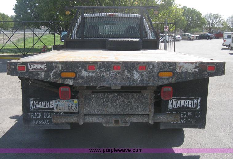 image for item B8134 2004 Ford F350 XL Super Duty flatbed pickup truck