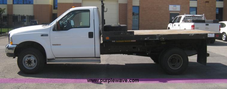 image for item B8134 2004 Ford F350 XL Super Duty flatbed pickup truck