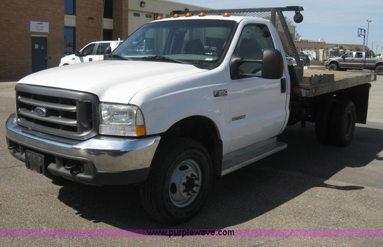 image for item B8134 2004 Ford F350 XL Super Duty flatbed pickup truck