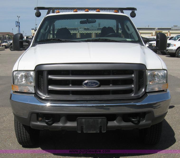 image for item B8134 2004 Ford F350 XL Super Duty flatbed pickup truck