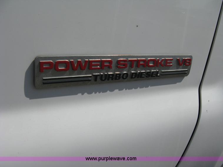 image for item B8134 2004 Ford F350 XL Super Duty flatbed pickup truck