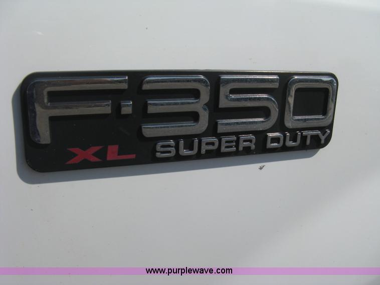 image for item B8134 2004 Ford F350 XL Super Duty flatbed pickup truck