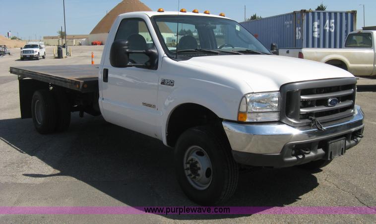 image for item B8141 2003 Ford F350 XL Super Duty flatbed pickup truck