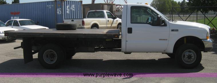 image for item B8141 2003 Ford F350 XL Super Duty flatbed pickup truck