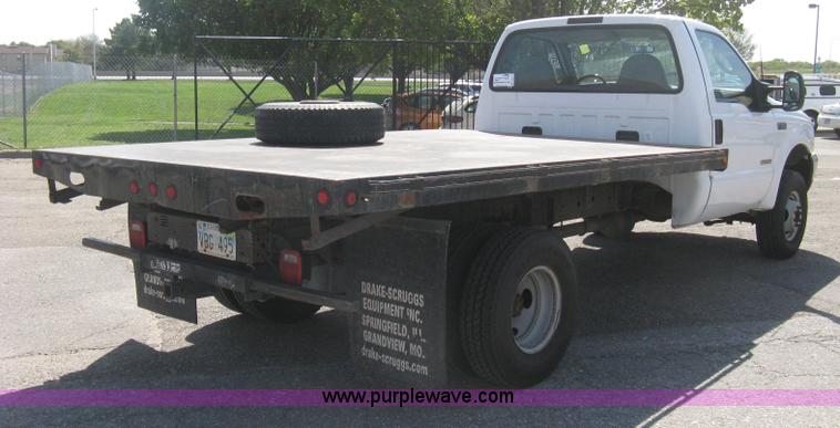 image for item B8141 2003 Ford F350 XL Super Duty flatbed pickup truck