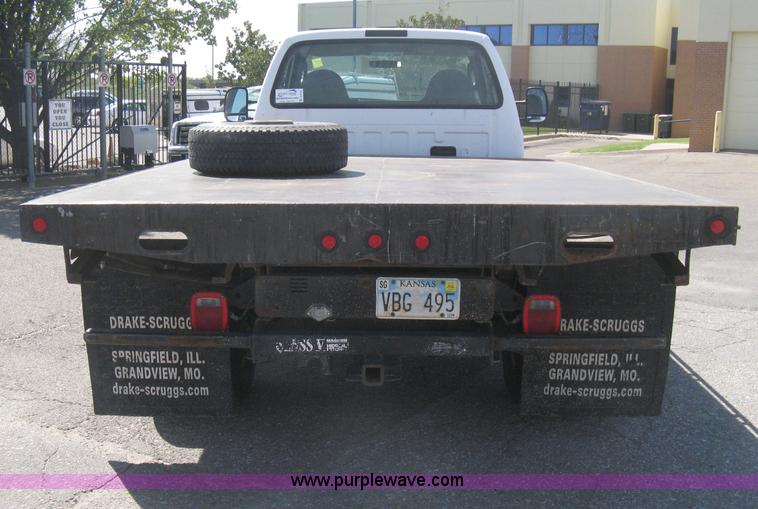 image for item B8141 2003 Ford F350 XL Super Duty flatbed pickup truck