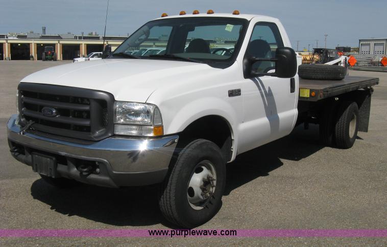 image for item B8141 2003 Ford F350 XL Super Duty flatbed pickup truck