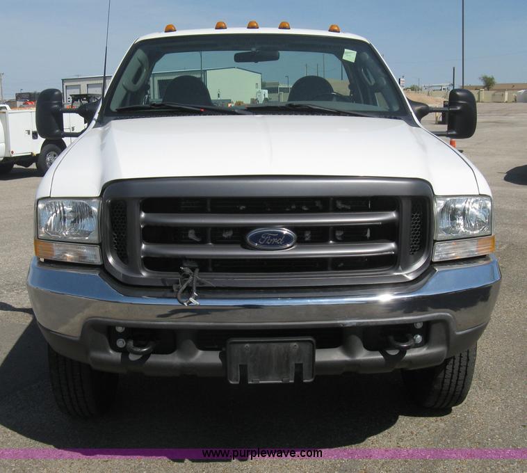 image for item B8141 2003 Ford F350 XL Super Duty flatbed pickup truck